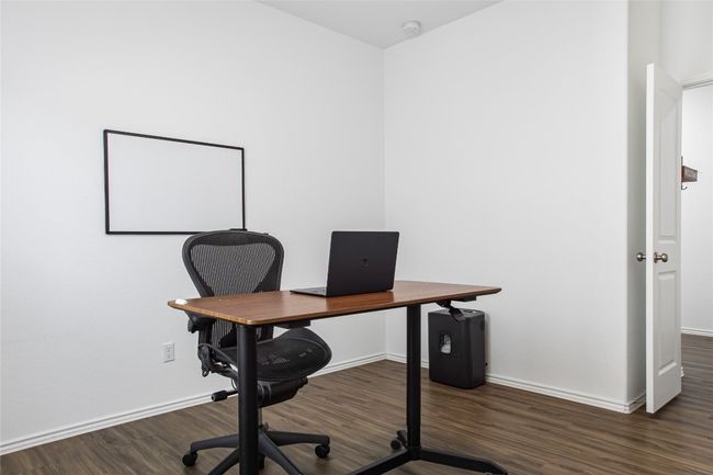 Office space with baseboards and wood finished floors | Image 19