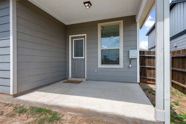 Property entrance with fence and a patio | Image 30