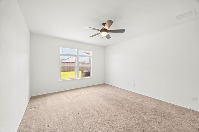 Unfurnished room featuring carpet, a ceiling fan, and baseboards | Image 19