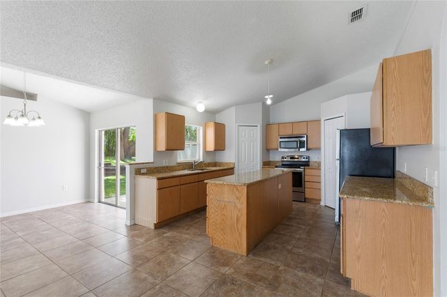 14006 Amero Ln, House other with 4 bedrooms, 2 bathrooms and null parking in Spring Hill FL | Image 5
