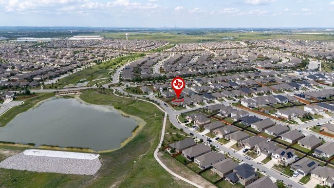 Aerial overview of property's location with nearby suburban area and a large body of water | Image 30