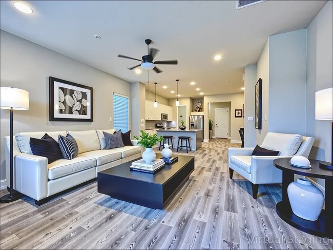Living room with light wood finished floors, a ceiling fan, recessed lighting, and baseboards | Image 14