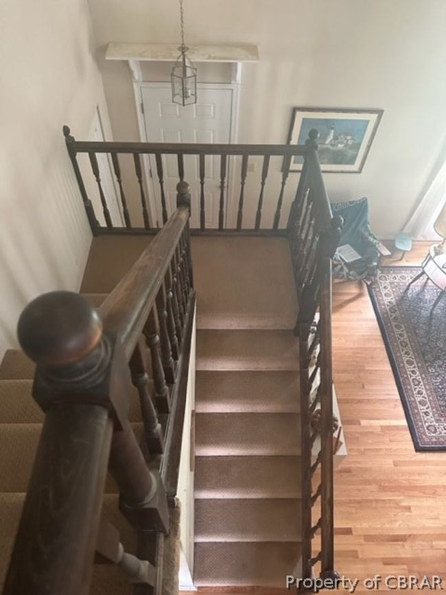 Stairs with light hardwood / wood-style flooring | Image 9