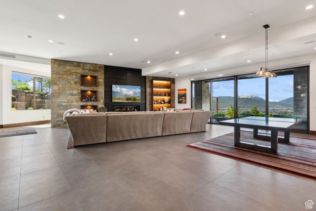 Living area with a fireplace and recessed lighting | Image 48