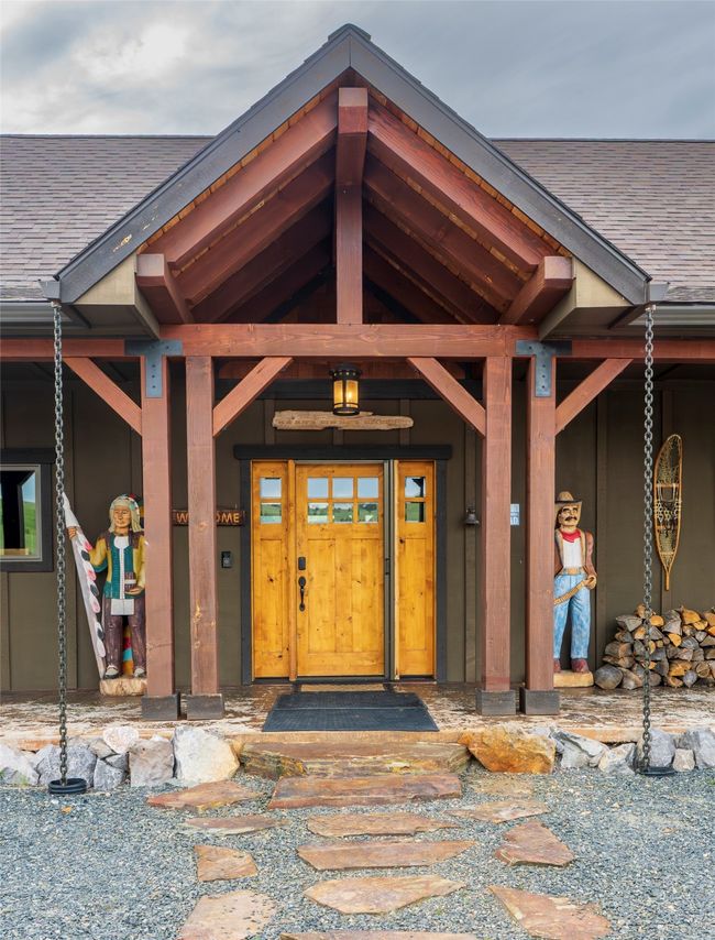 Doorway to property with roof with shingles and a porch | Image 5