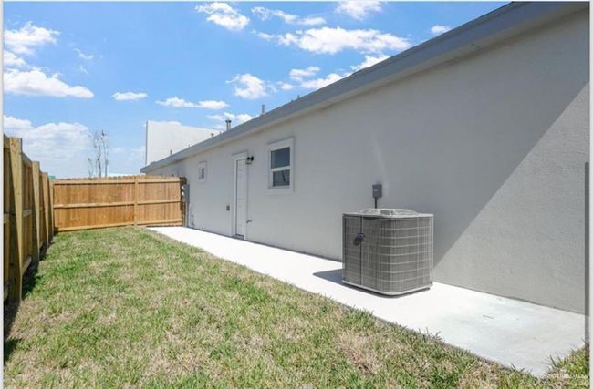 View of yard with a patio and central AC unit | Image 12