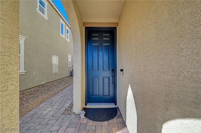 Property entrance with stucco siding | Image 5