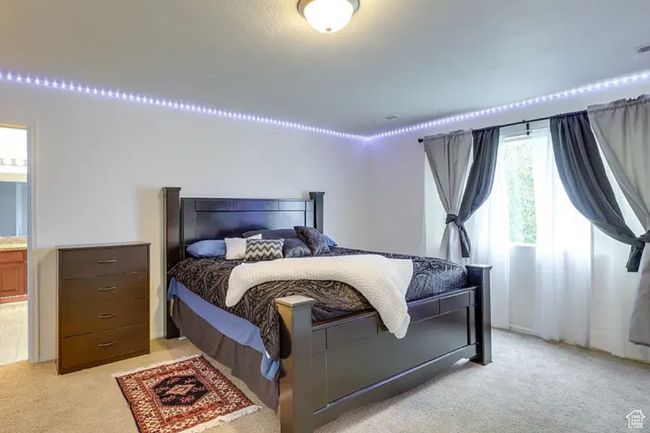 Bedroom with light colored carpet | Image 21