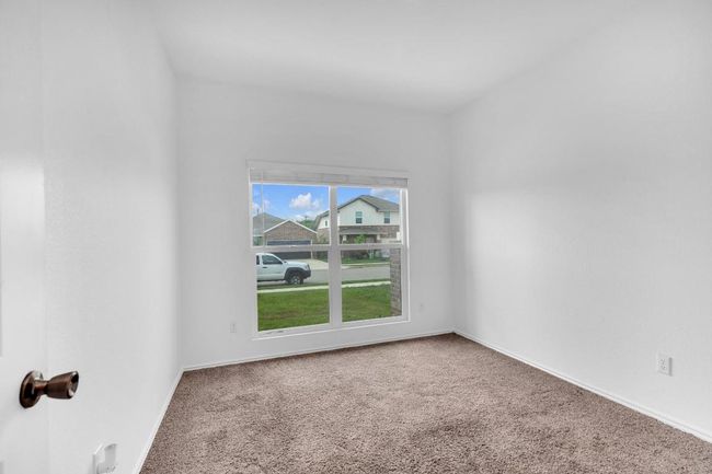 Carpeted spare room featuring baseboards | Image 16