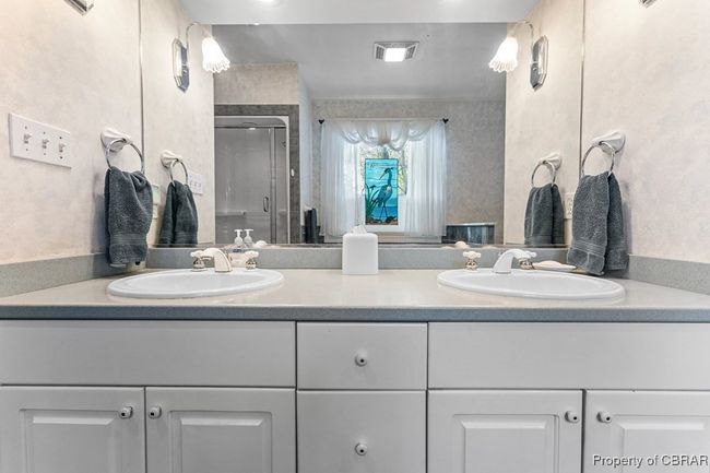 Full bathroom with double vanity and a stall shower | Image 31