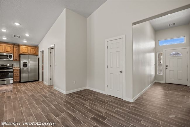 Entryway featuring baseboards, recessed lighting, and dark wood-style flooring | Image 42