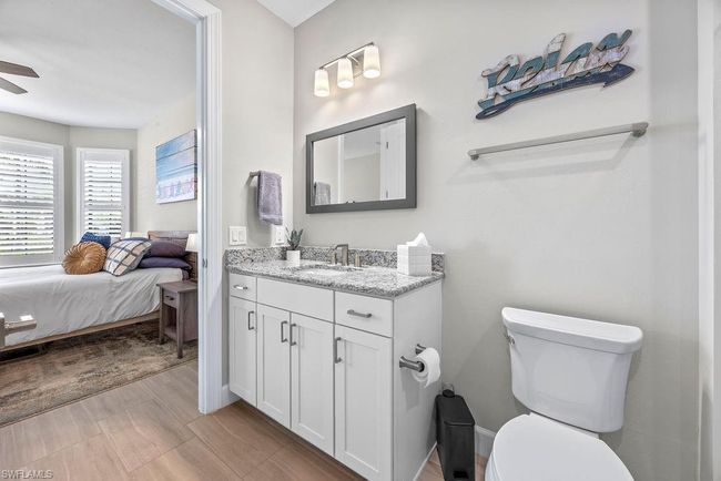 Bathroom with vanity, wood finished floors, ensuite bath | Image 12