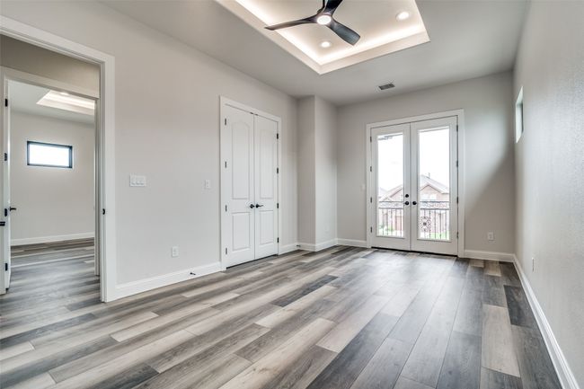 Empty room with french doors, hardwood / wood-style flooring, and a wealth of natural light | Image 18