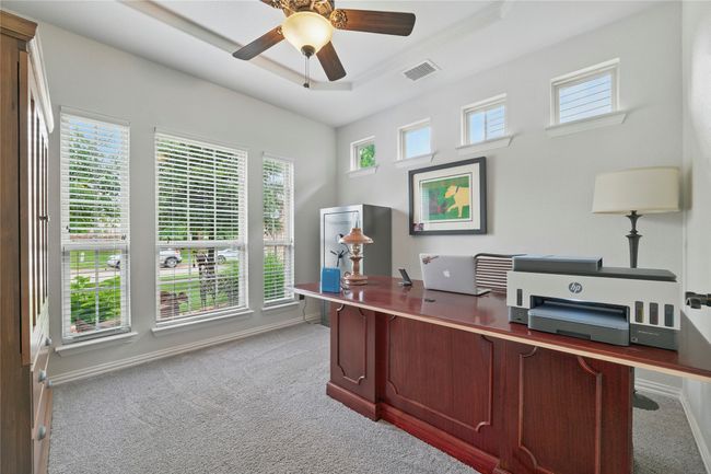 Carpeted office featuring a ceiling fan and baseboards | Image 7