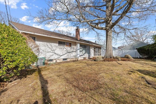 Rear view of house with a lawn | Image 18