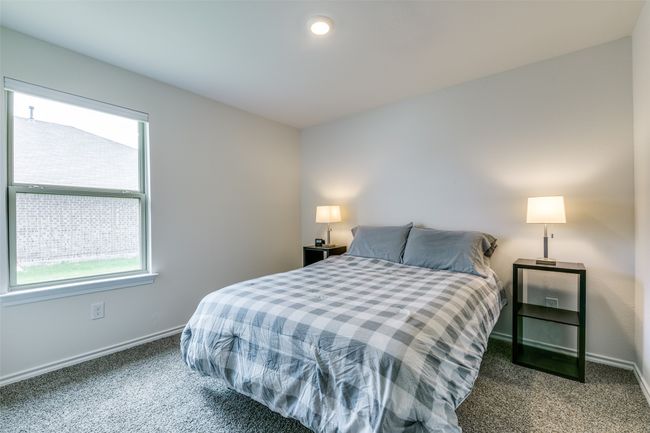 Bedroom featuring dark colored carpet | Image 18