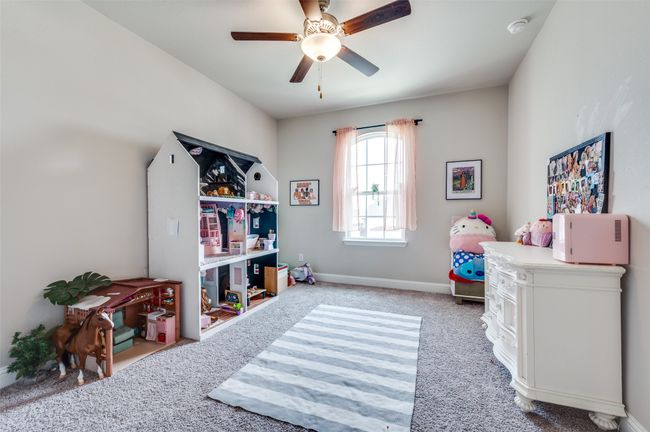 Playroom featuring carpet flooring, baseboards, and ceiling fan | Image 18