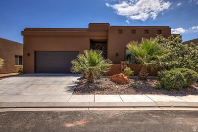 Pueblo-style house with a garage | Image 3