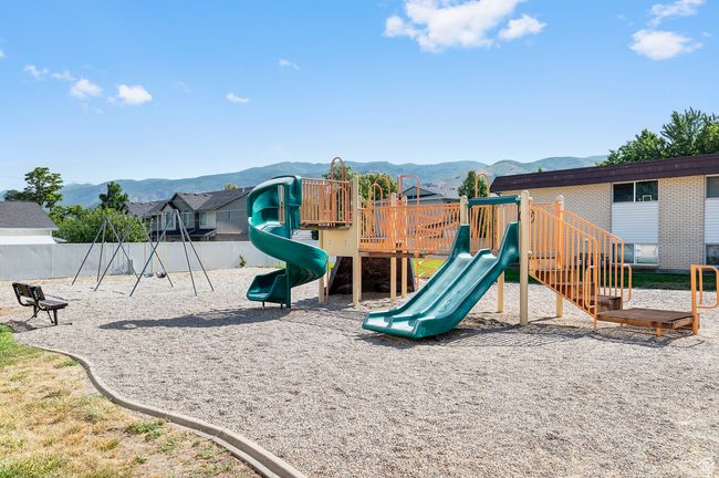 Communal playground featuring a mountain view | Image 17