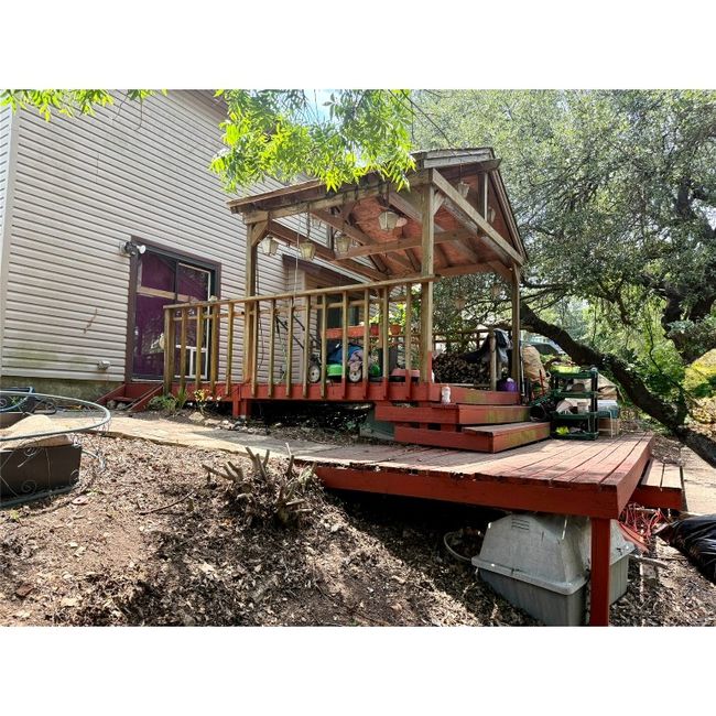 View of partially covered wooden deck | Image 5