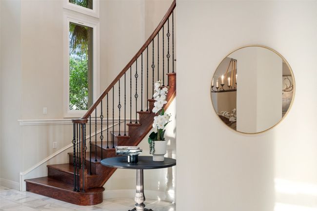 Staircase with baseboards and marble finish floors | Image 6