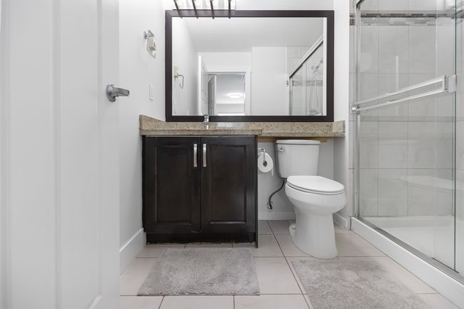 Primary Ensuite with tile patterned floors, a stall shower, and vanity | Image 12
