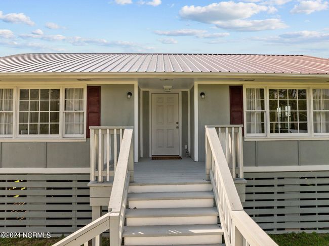 Metal Roof and lovely front porch welcome you in! | Image 4
