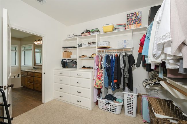 Spacious closet with wood finished floors and a sink | Image 20