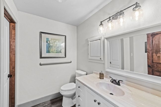 Carpeted empty room with recessed lighting and a drop ceiling | Image 10