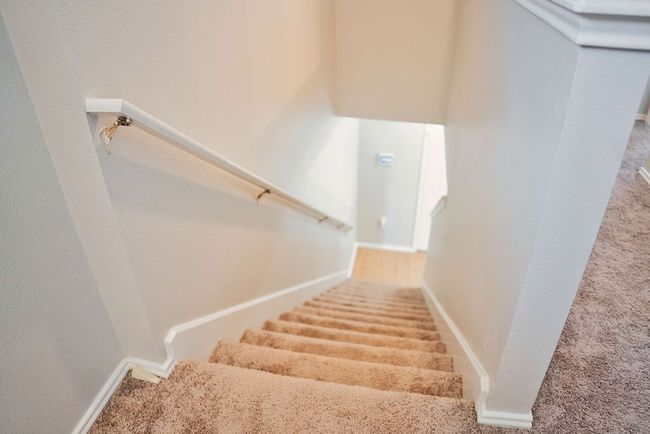 Stairway featuring carpet and baseboards | Image 17