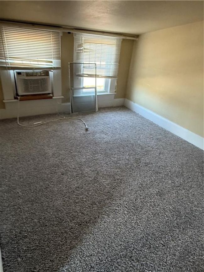 Spare room with baseboards and cooling unit | Image 22