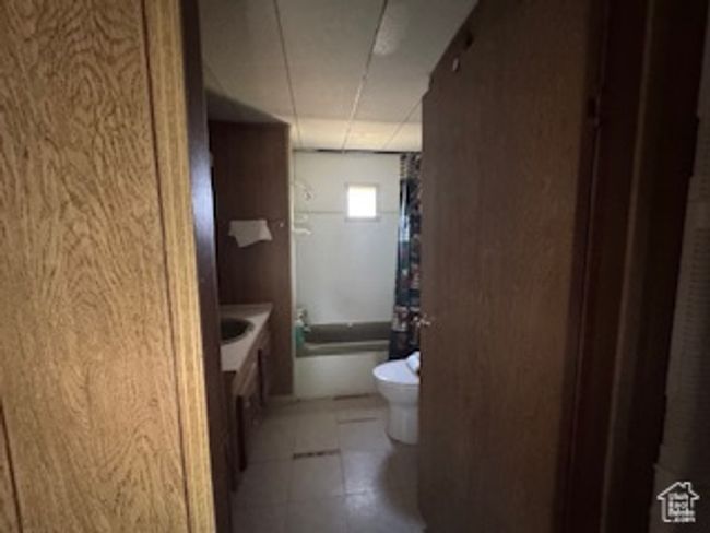 Full bath with vanity and tile patterned floors | Image 9