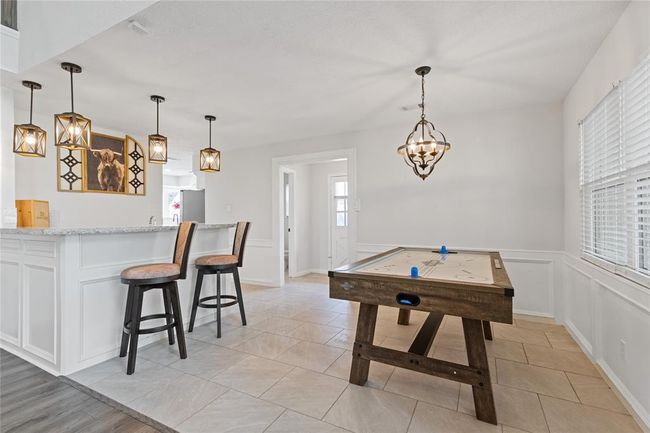 Breakfast room area used for air hockey table. | Image 15