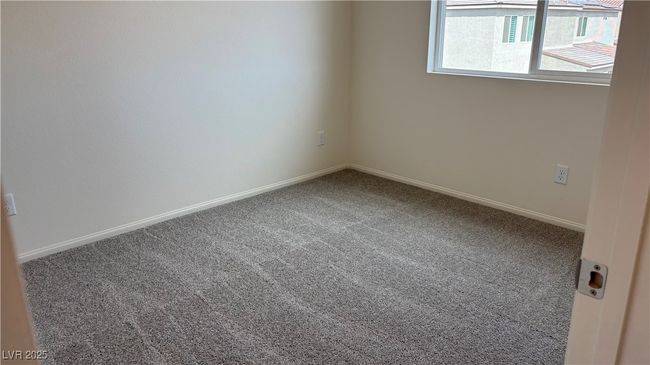 Carpeted spare room featuring baseboards | Image 10