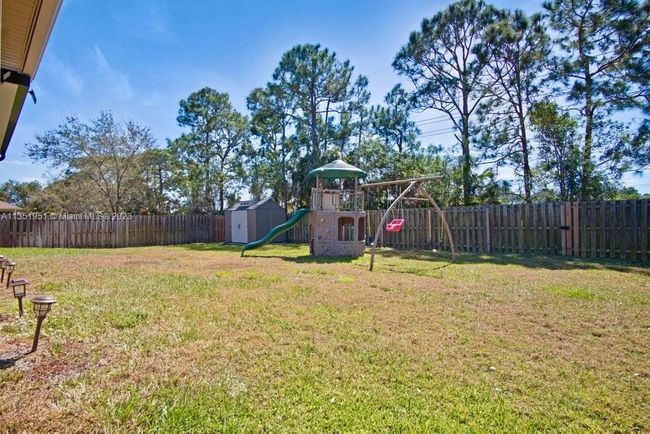 5806 Nw Breezy Brook Ct, House other with 3 bedrooms, 2 bathrooms and null parking in Port St. Lucie FL | Image 32