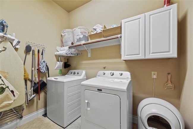 Utility closet with shelves and cabinets for all your laundry needs. | Image 41