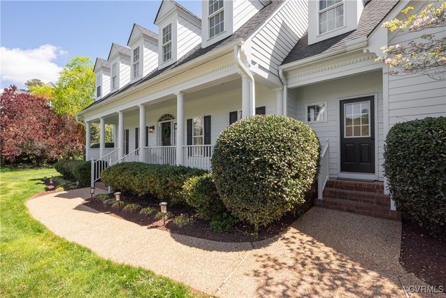 View of side of property featuring a porch and a shingled roof | Image 4