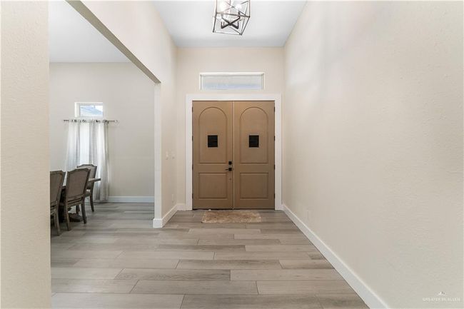 Foyer entrance featuring light wood-type flooring and a chandelier | Image 26