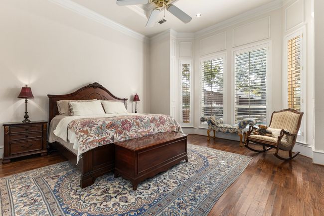 Bedroom with ornamental molding, ceiling fan, and hardwood / wood-style floors | Image 16