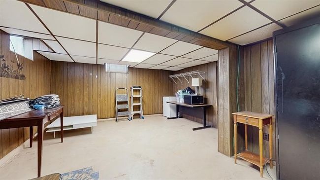 The lower level includes a generous rec room—perfect for a home office, workout area, or hangout space—plus laundry and plenty of storage. | Image 12