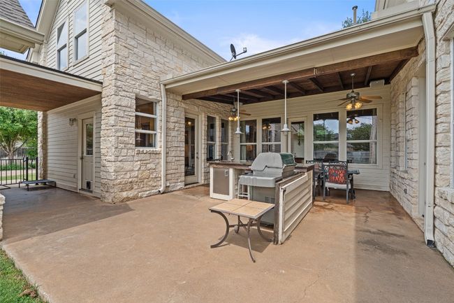 View of patio featuring a ceiling fan | Image 33
