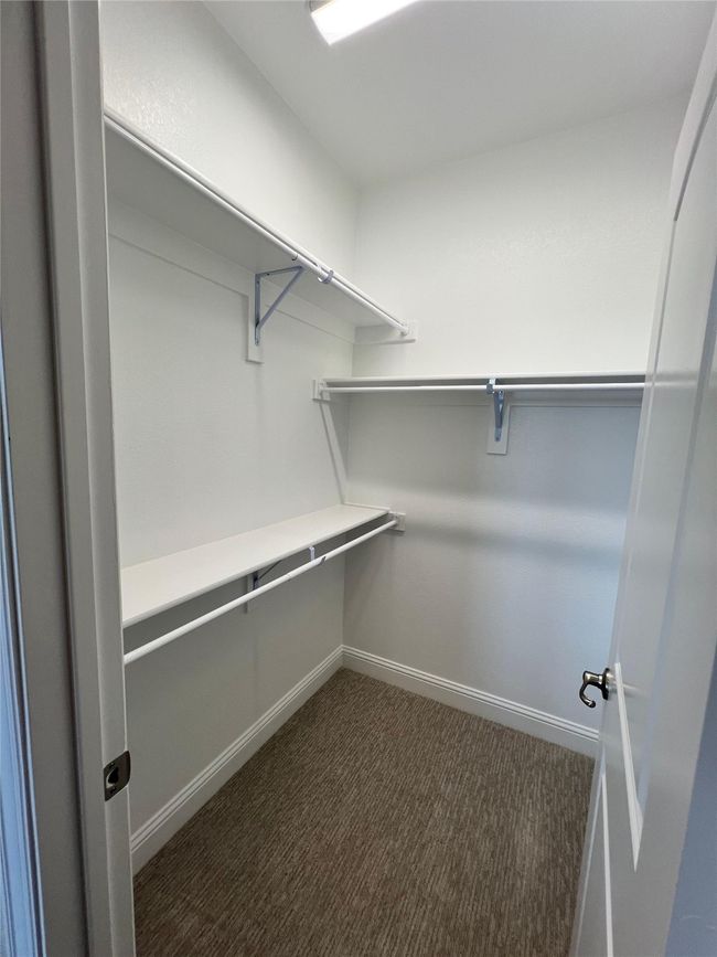 Walk in closet featuring carpet flooring | Image 20