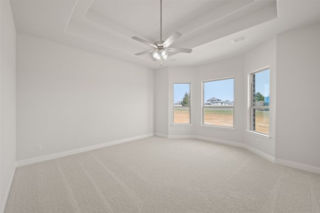 Empty room featuring light carpet and baseboards | Image 15