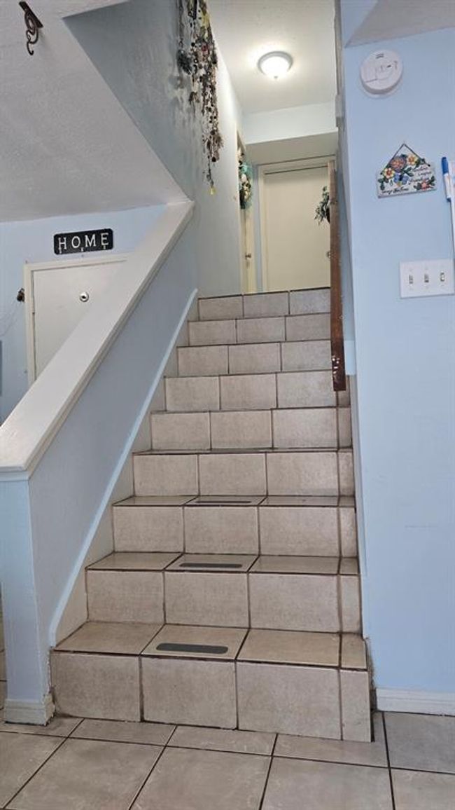 Beds and Bath are upstairs. Right this way and watch your step. | Image 7