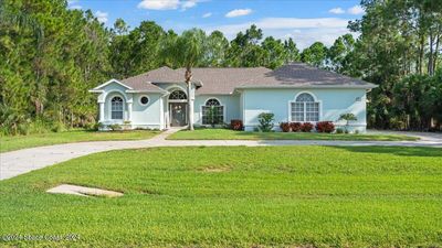 3064 Green Turtle Circle, House other with 4 bedrooms, 3 bathrooms and null parking in Mims FL | Image 2