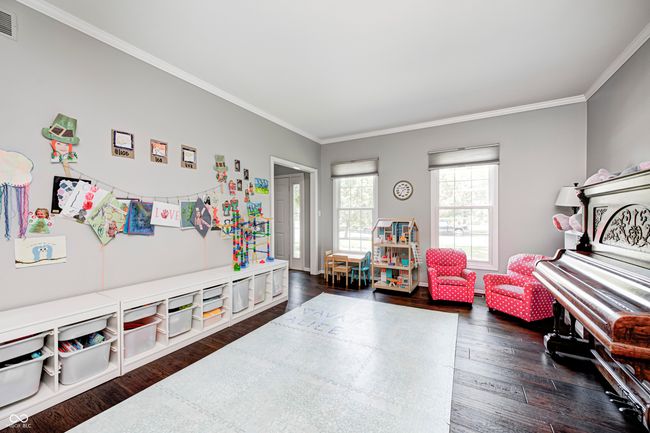 Kid-friendly flex area or cozy living room on main level | Image 18