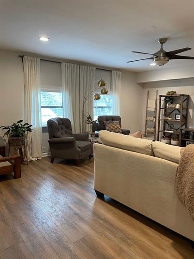 Living area featuring ceiling fan, light wood-style flooring, and recessed lighting | Image 8