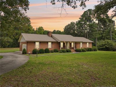 Front Twilight View of main home. | Image 3