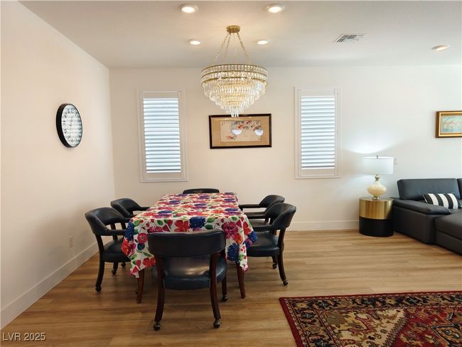 Dining space with a chandelier, visible vents, baseboards, light wood-type flooring, and recessed​​‌​​​​‌​​‌‌​‌‌​​​‌‌​​‌‌​‌​​​​​‌ lighting | Image 8