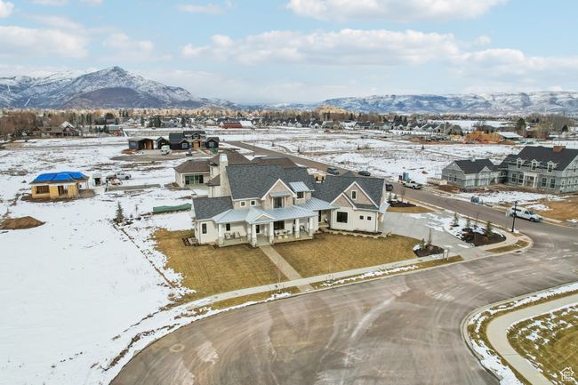 Snowy aerial view featuring a residential view and a mountain view | Image 58